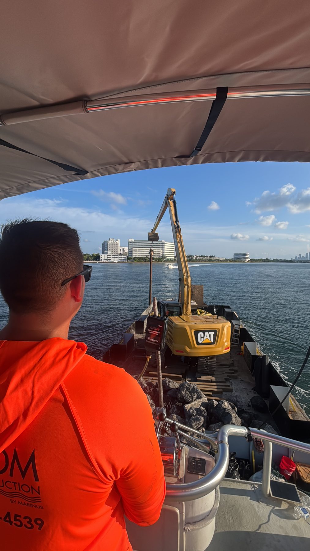 CMC by Marinus crew running the push boat on the Miami River