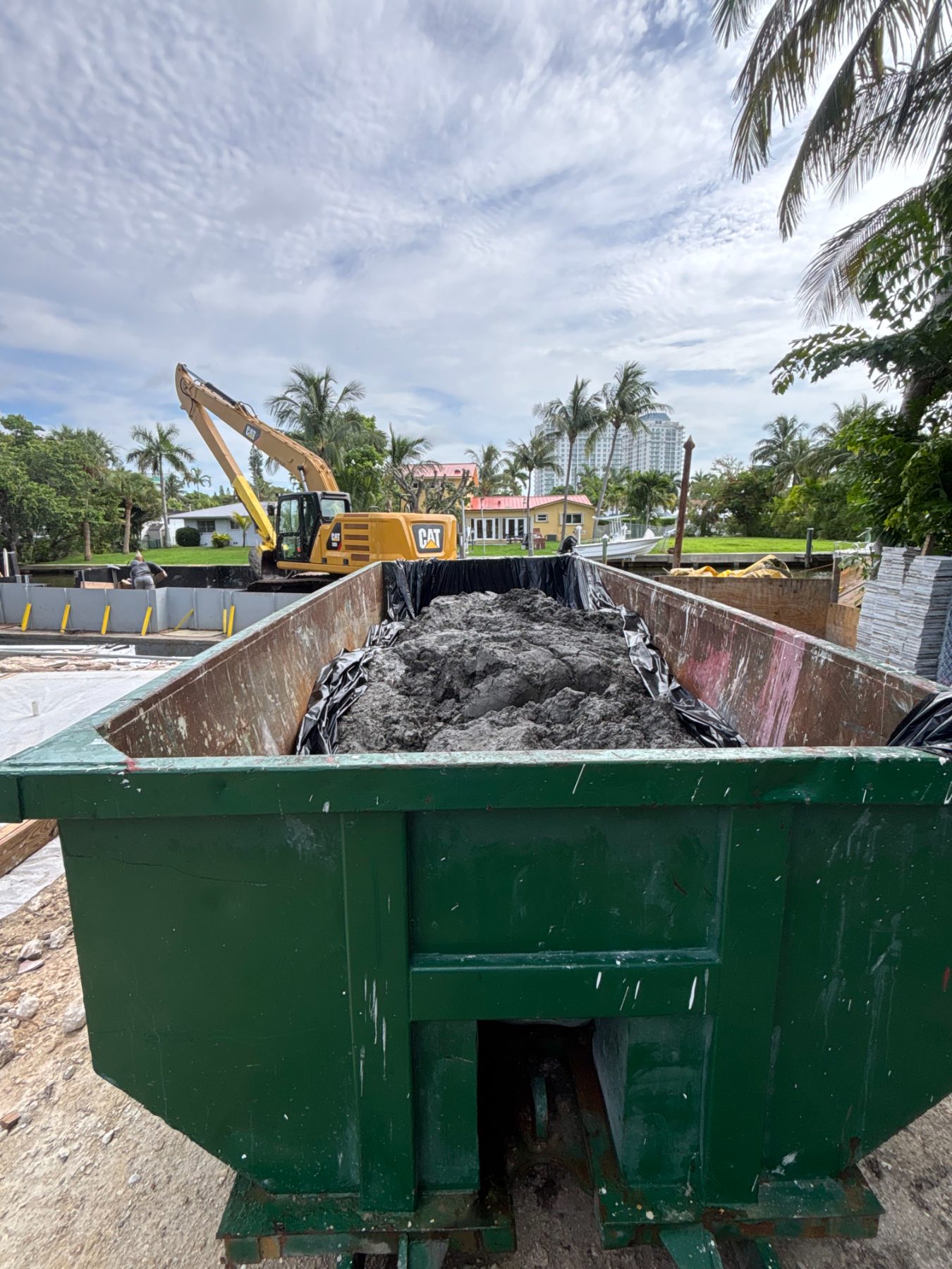 Dredge spoil loaded into a lined bin