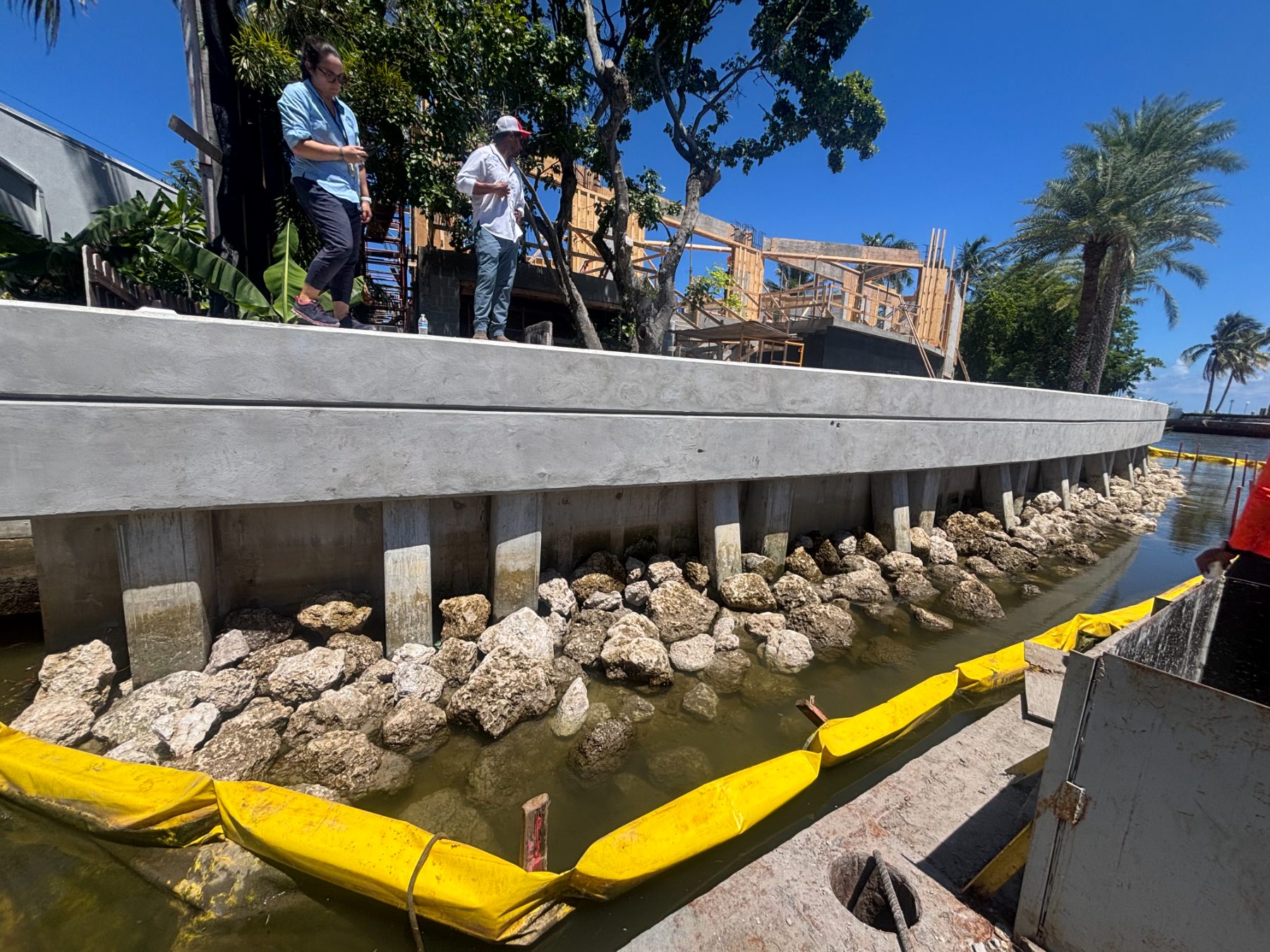 Finished seawall cap and riprap on a residential canal